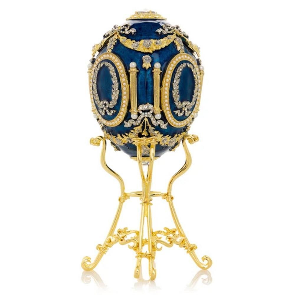 Sapphire Blue Inspired Faberge Egg With Swan Encased: Sapphire Blue Inspired Faberge Egg With Swan Encased Introducing the breathtaking Sapphire Blue Faberge Egg With Swan Encased. Crafted to perfection, this exquisite masterpiece boasts a dazzling