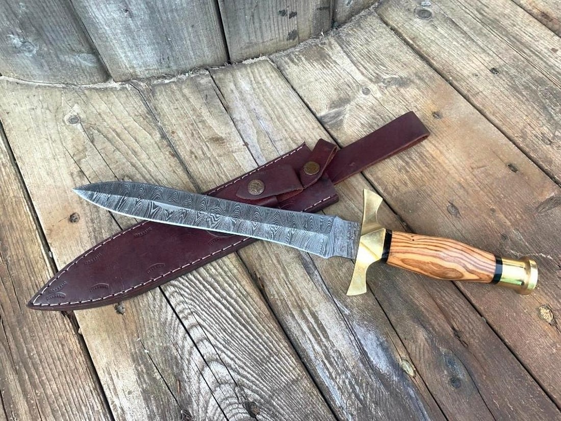 The Spartans Damascus Dagger: Custom Handmade Damascus Steel Dagger Hunting Dagger Knife Handle Olive Wood with Brass Spacer Damascus Steel Blade with 256 Layers on it. HARDNESS 56-60 H R C VERY HIGH QUALITY GENUINE LEATHER