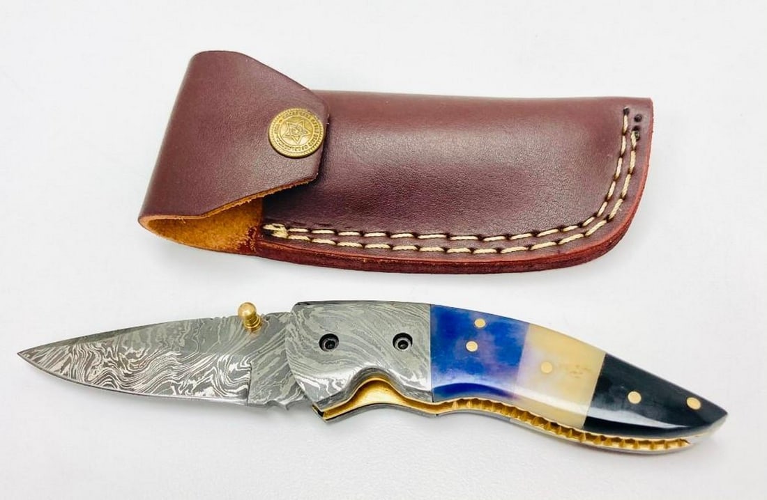 Tranquilities Folding Damascus Knife: Tranquilities Folding Damascus Knife Custom Handmade Damascus Steel Hunting, Camping & Folding Knife Handle color Camel Bone. Damascus Steel Blade with 256 Layers on it. HARDNESS 56-60 H R C VERY