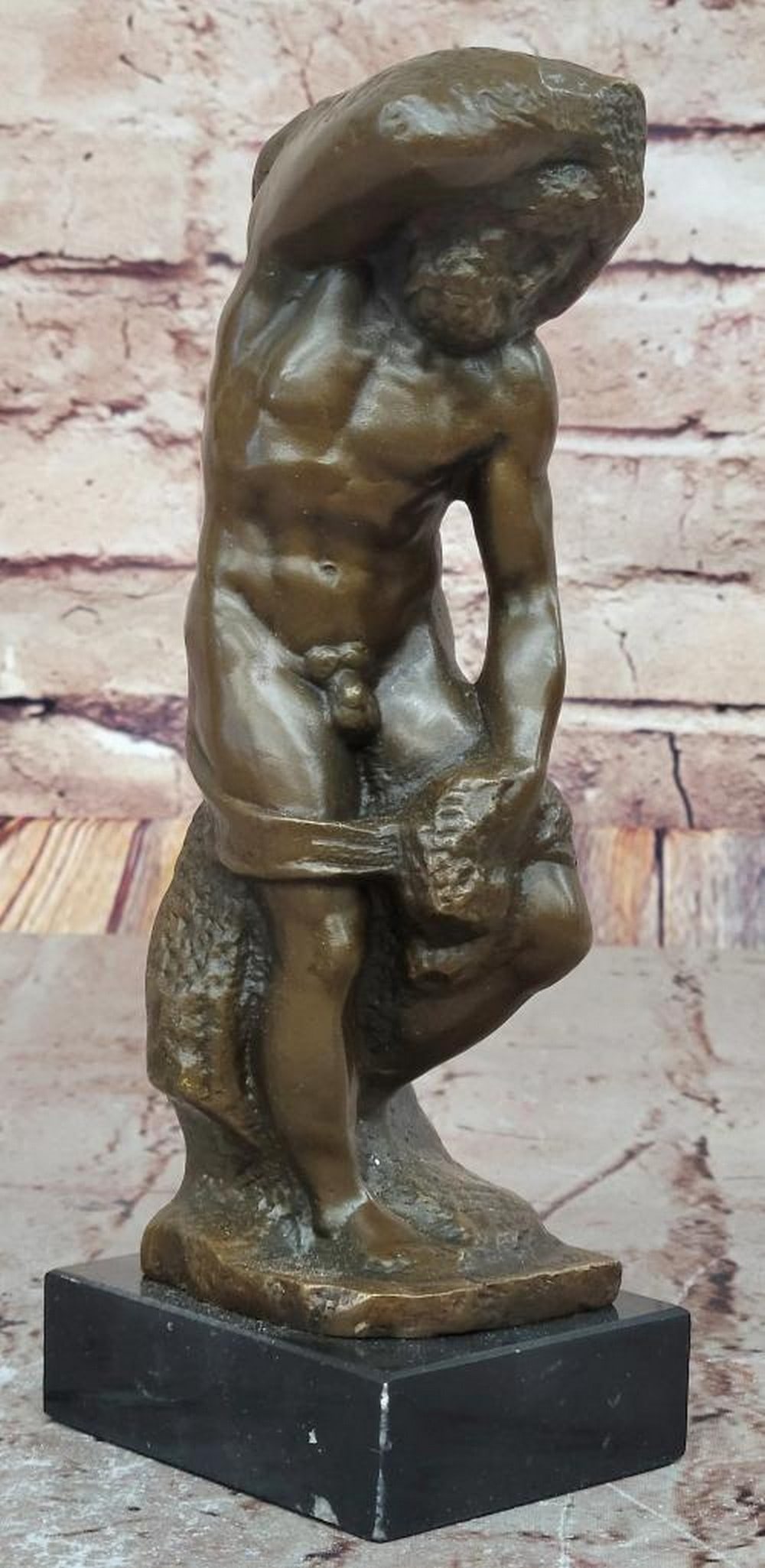 'The Slave'' Bronze Sculpture - Reproduction of Michelangelo's Masterpiece: " The Slave" Bronze Sculpture - Reproduction of Michelangelo s Masterpiece his striking bronze sculpture, titled " The Slave" or " The Prisoners," is a masterful reproduction of Mich