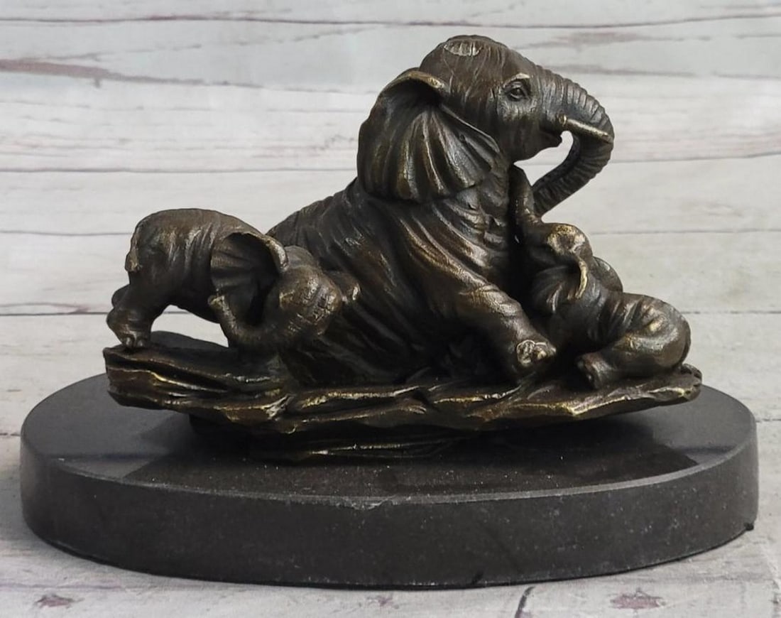 Enduring Bond Bronze Elephant Sculpture by Milo - 5 ''x 6'': Enduring Bond Bronze Elephant Sculpture by Milo - 5 " x 6" This touching bronze sculpture by Milo captures a tender moment between a mother elephant and her calf, symbolizing the strength and de