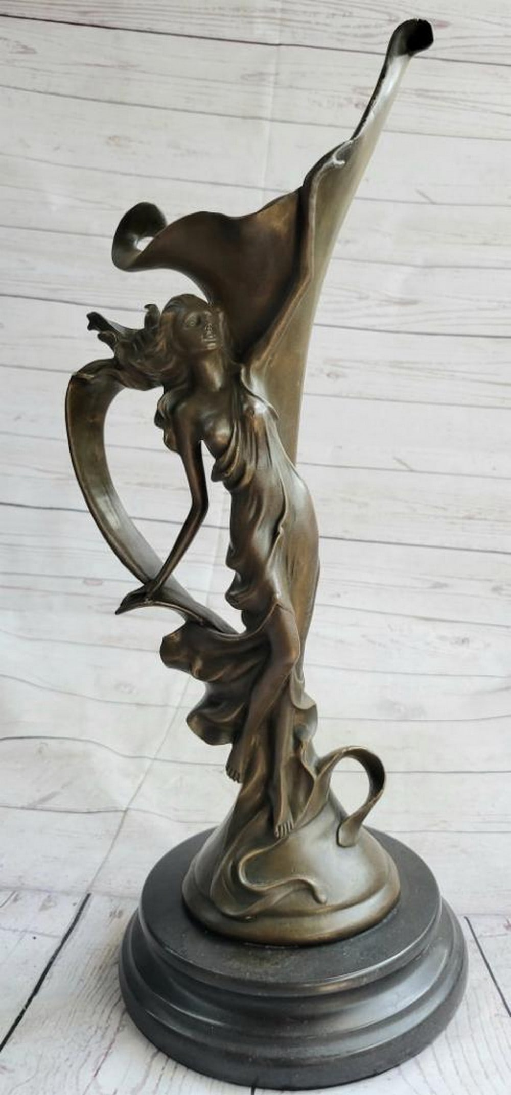 Nymph in Bloom Bronze Art Nouveau Vase - 20'' x 8'': Nymph in Bloom Bronze Art Nouveau Vase - 20" x 8" This stunning vase celebrates the elegance of nature, featuring a delicate nymph poised amid a flourishing array of flowers and vines. Crafted u