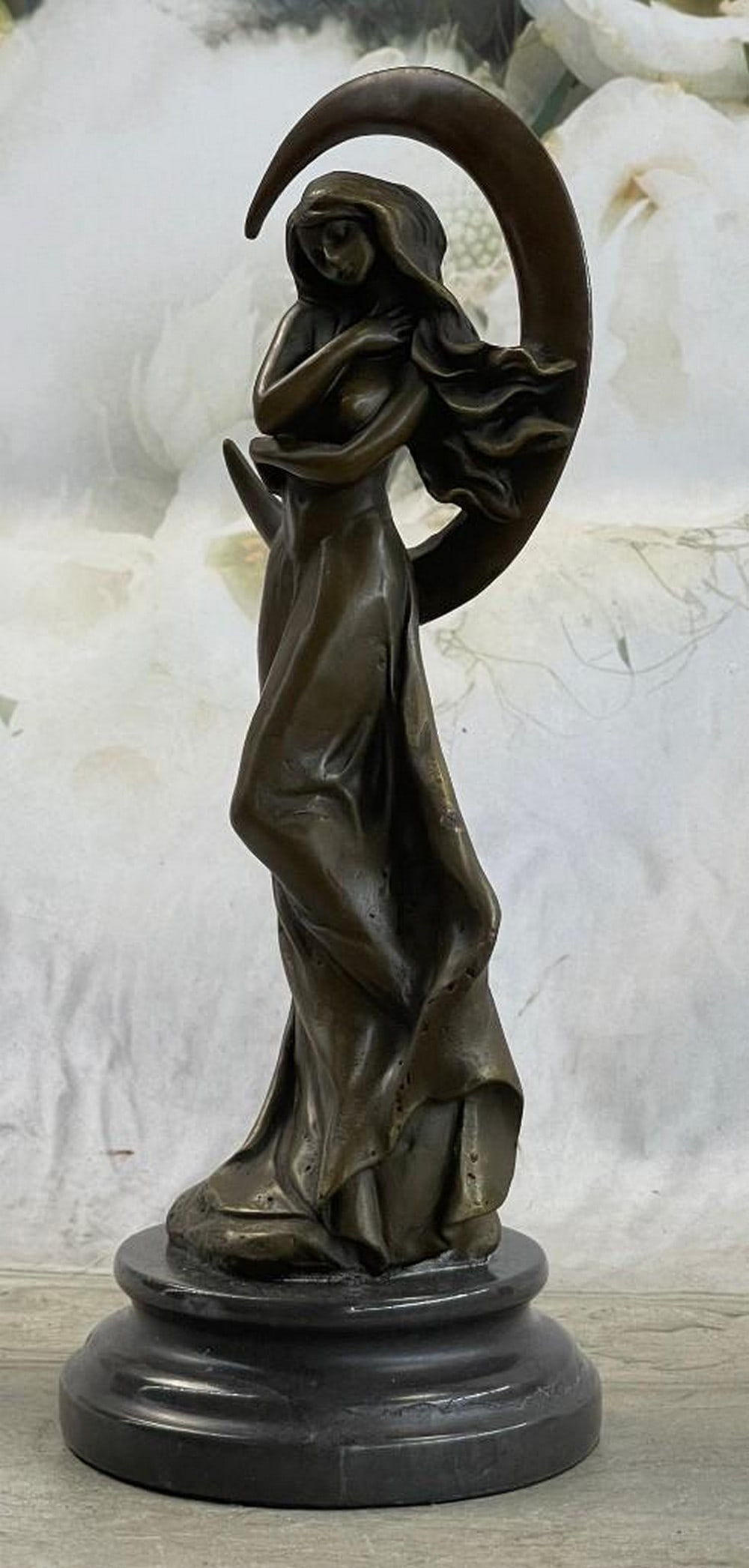 Aphrodite ~ Goddess of Love & Beauty Genuine Bronze Statue: Aphrodite ~ Goddess of Love & Beauty Genuine Bronze Statue The solid bronze sensual woman stands upward, extending her hands behind her head. Her arms wrap around her head in a grasp of fervor. Her fu