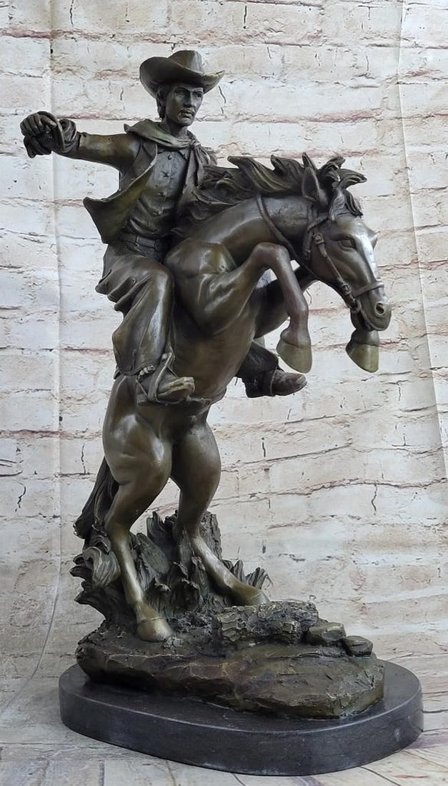 Remington Inspired Bronco Buster Bronze Sculpture - 20'' x 14'': Remington Inspired Bronco Buster Bronze Sculpture - 20" x 14" Experience the untamed spirit of the Wild West with this captivating bronze sculpture. A seasoned cowboy fearlessly rides his wild h