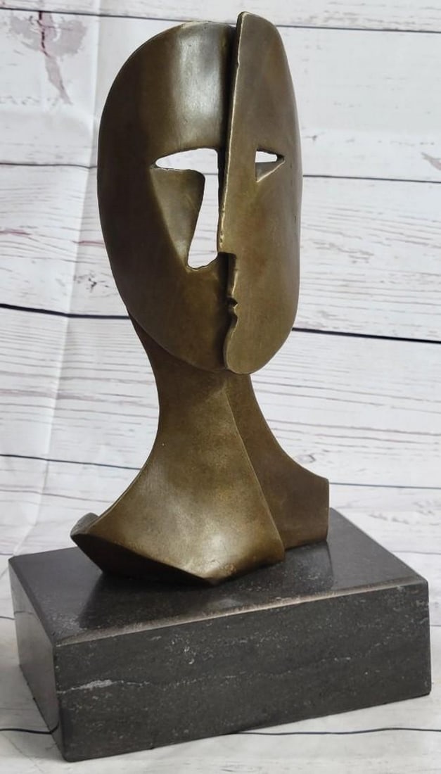 Two Masked Faces Bronze Sculpture: Two Masked Faces Bronze Sculpture Woman and Man - the sun on the right represents the woman, the slither of a moon on the left the man. I use the mythical language of fairy tales, yet years after its 