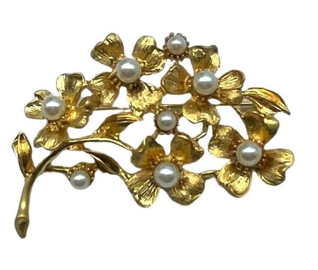 18KTGP Floral Brooch with Inlaid White Pearl Accents with Satin-Matte Gold Petals: 18KTGP Floral Brooch with Inlaid White Pearl Accents with Satin-Matte Gold Petals White pearls are thought to symbolize innocence, new beginnings, beauty and sincerity. They have also been said to sig