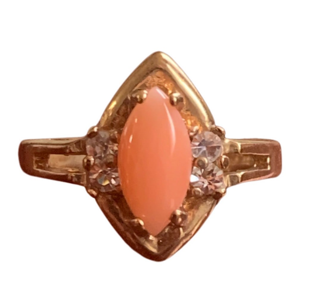 18KT Gold Plated Oval Shaped Coral Gemstone Inlaid with Austrian Crystal Ring: 18KT Gold Plated Oval Shaped Coral Gemstone Inlaid with Austrian Crystal Ring Pink Coral stimulates sensitivity, with respect to ones emotions and physical condition. It activates the heart chakra, en