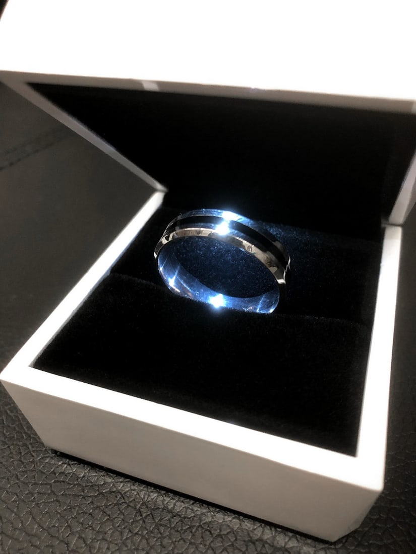 Men's Titanium Steel Silver Black Engagement Ring: Titanium Steel Silver Brushed, Black Engagement Ring. Brand New Comes in White Enameled LED Ring Box. See Photos for further inspection.