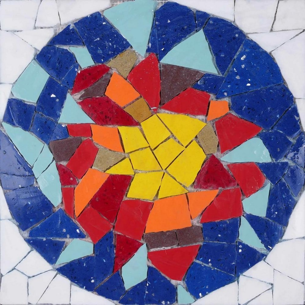 Abstract Mosaic - Colorful Design: Abstract Mosaic - Colorful Design A handcrafted mosaic made from natural stone. The piece features a circular abstract pattern with blue, red, and yellow tones created by individually cut and