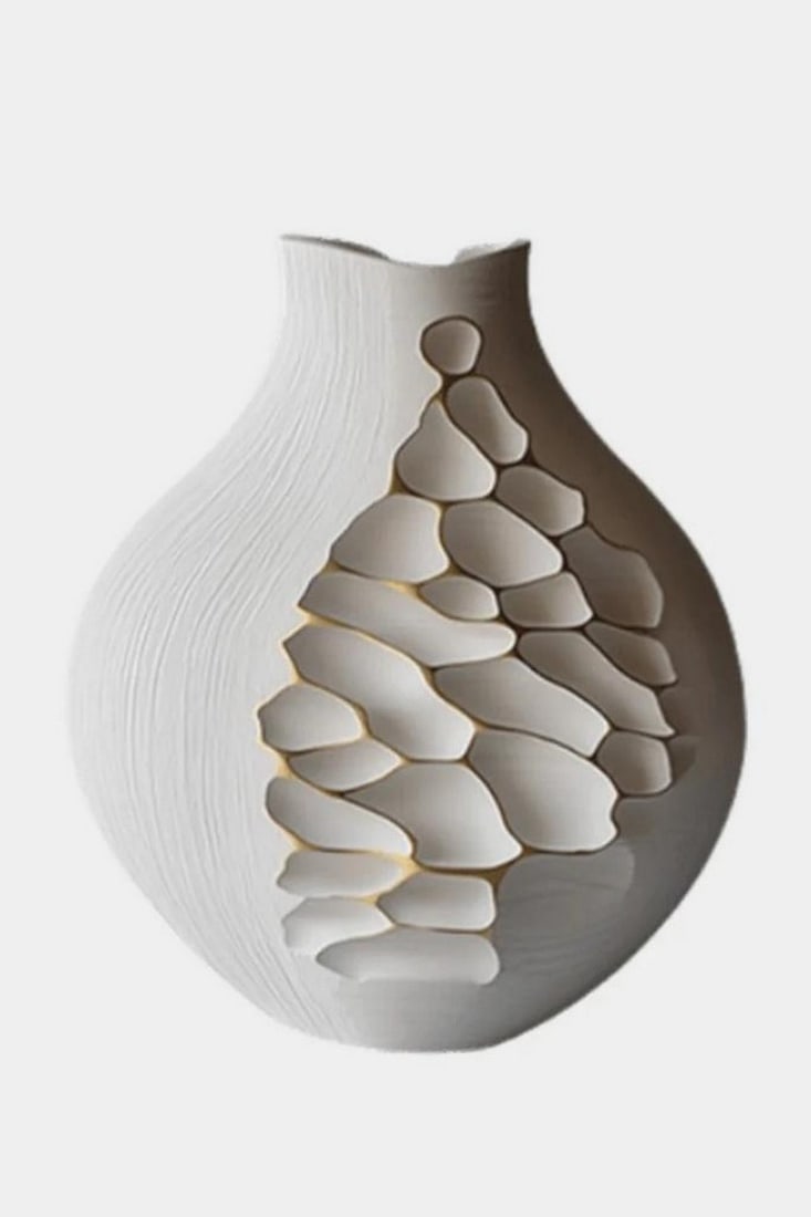 Fragment Bloom' - Contemporary Wooden Sculpture: 'Fragment Bloom' - Contemporary Wooden Sculpture A poetic interplay of texture and light, this sculptural piece features a rounded body with a narrow neck, carved in layered, irregular cut-outs that e
