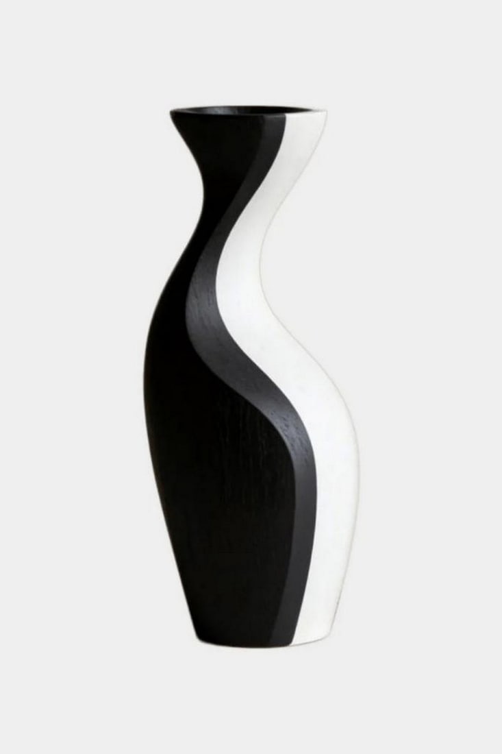 Dual Flow Contrast' - Contemporary Wooden Vase: 'Dual Flow Contrast' - Contemporary Wooden Vase A striking study in balance and movement, this sculptural vase features a sinuous silhouette divided into two contrasting surfaces of deep black and sof