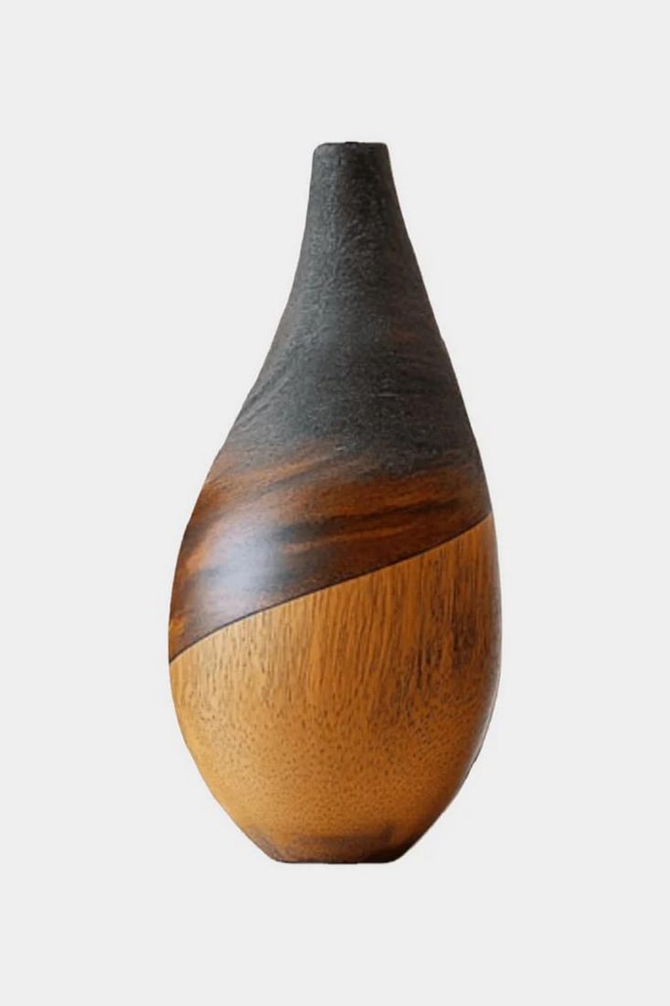 Burnished Horizon' - Contemporary Wooden Vase: 'Burnished Horizon' - Contemporary Wooden Vase A refined sculptural form with a smooth, elongated silhouette, this vase blends natural wood grain with a dark textured upper finish. The gentle diagonal