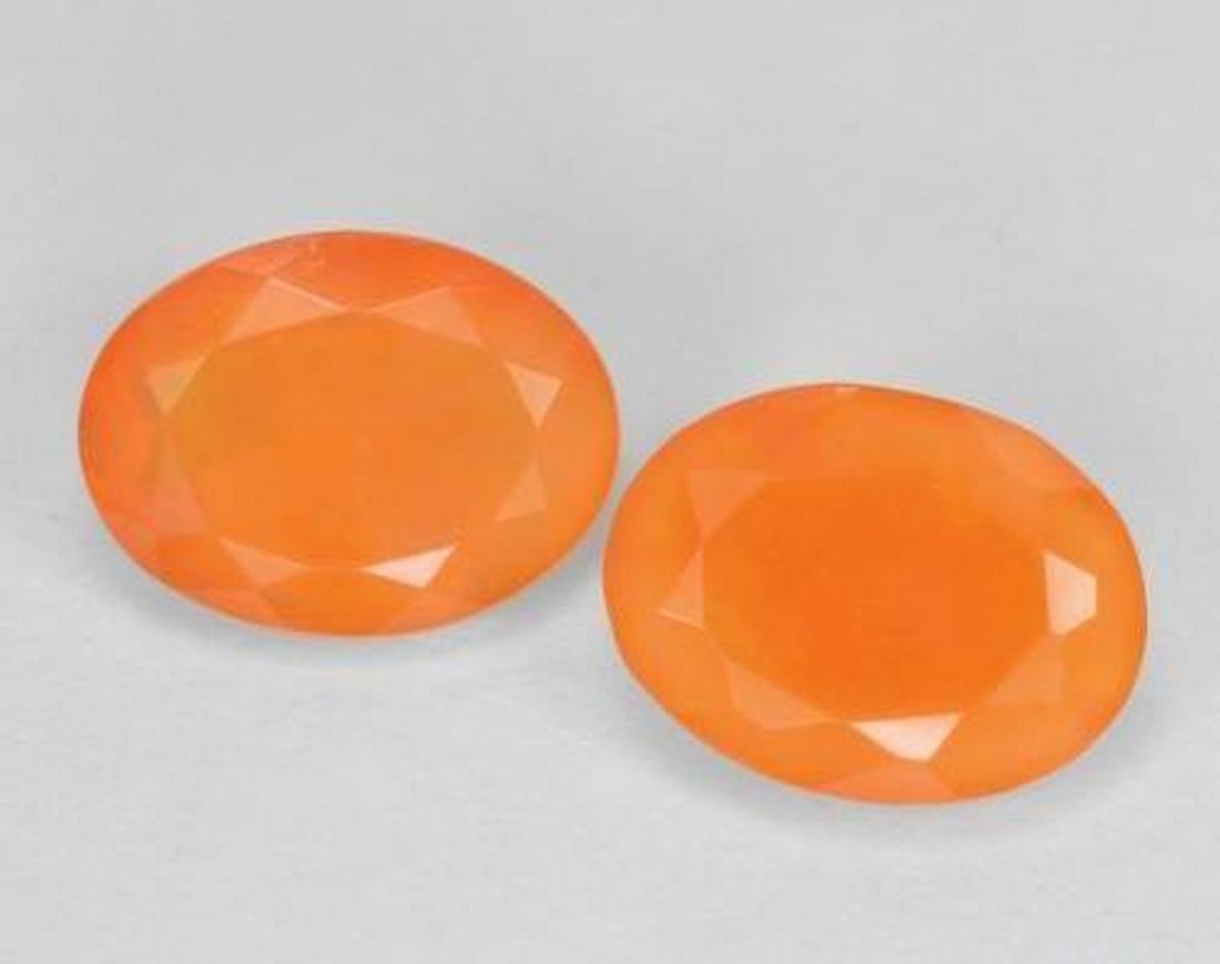 1.35 ctw Natural Apricot Orange Fire Opal, Oval Cut, Translucent, Mexico: 1.35 ctw Natural Apricot Orange Fire Opal, Oval Cut, Translucent, Mexico Pair of natural fire opal gemstones with a combined weight of 1.35 carats (average 0.68 carats each), cut in oval facet shape w