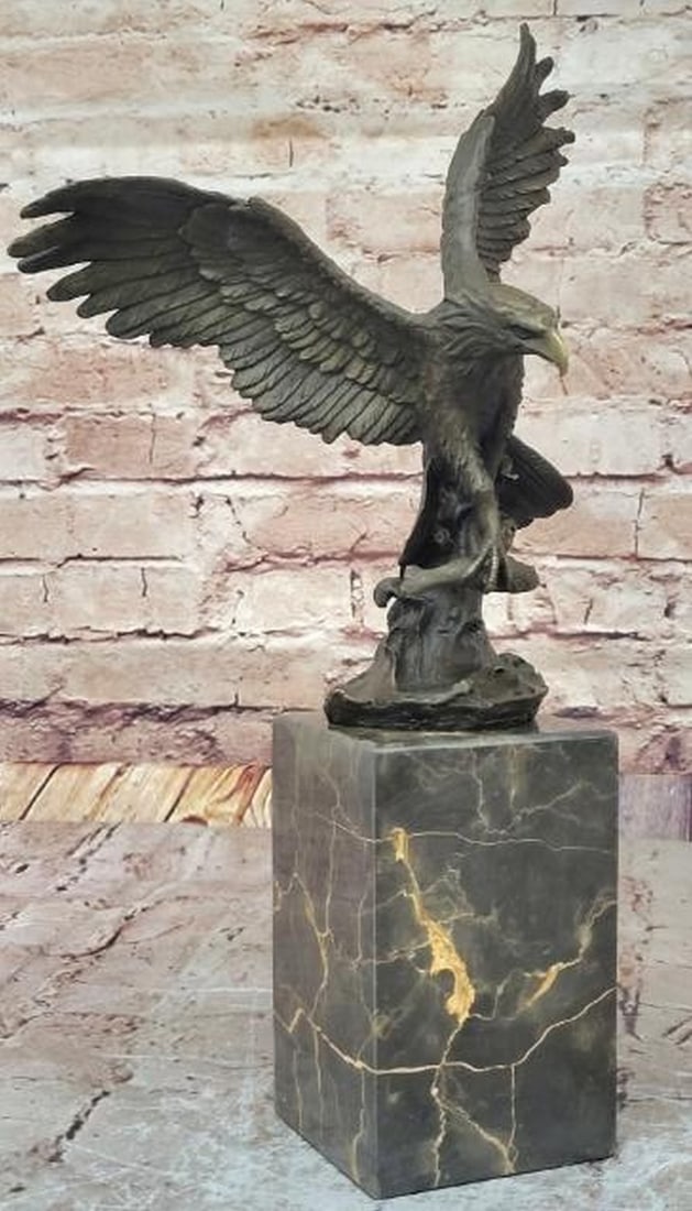 American Bald Eagle Clutching a Fish Bronze Statue - 14" x 8": American Bald Eagle Clutching a Fish Bronze Statue - 14" x 8" Immerse yourself in the awe-inspiring world of nature's apex predator through this captivating bronze eagle sculpture. Frozen in m