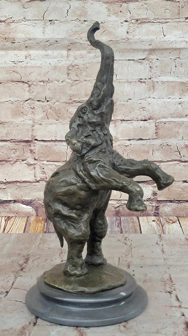 Majestic Rearing Elephant Bronze Sculpture on Marble Base - 15" x 6": Majestic Rearing Elephant Bronze Sculpture on Marble Base - 15" x 6" This bronze sculpture captures a male elephant in a lively moment, plunging his trunk into water and spraying over his body