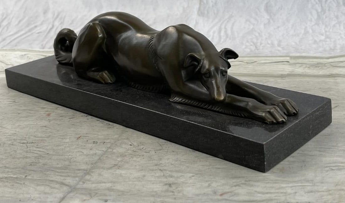 Patient and Loving Greyhound Dog Bronze Sculpture: Patient and Loving Greyhound Dog Bronze Sculpture This patient and loving Greyhound dog rests on the ground. His long, lean body stretches out and his head lays on his front leg. His thick tail curls 