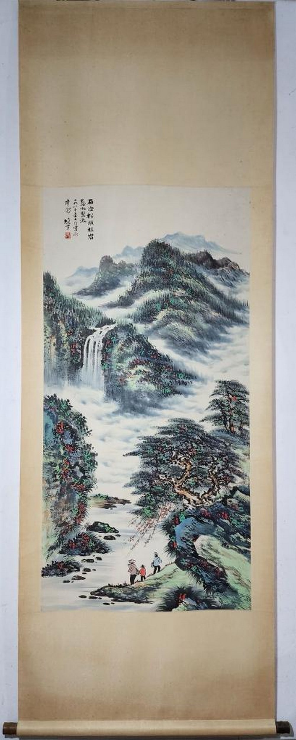 Mountain Tranquility Inspired Scroll Painting by Li Xiongcai: Mountain Tranquility Inspired Scroll Painting by Li Xiongcai This majestic handpainted scroll, inspired by the expressive style of Li Xiongcai, portrays a lush mountain landscape alive with movement a