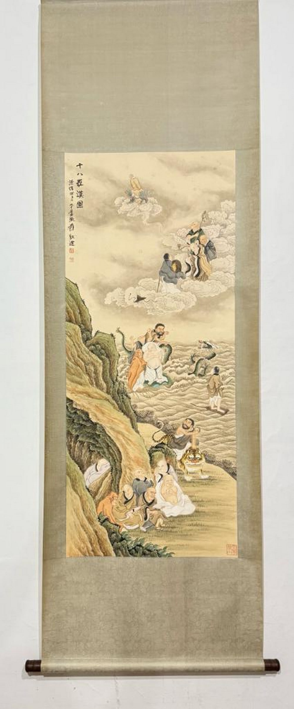 Ten Elders in Celestial Journey Inspired Scroll Painting by Zhang Daqian: Ten Elders in Celestial Journey Inspired Scroll Painting by Zhang Daqian This evocative handpainted paper scroll, inspired by the spiritual depth of Zhang Daqian, portrays a gathering of ten elder fig
