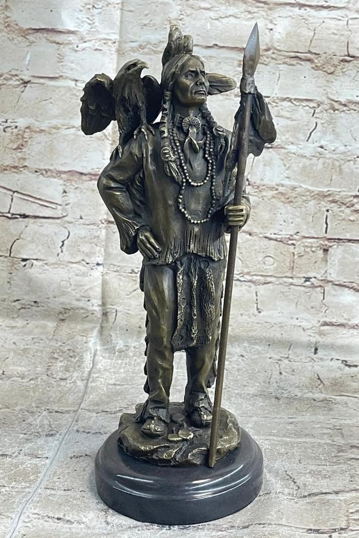 Native American Warrior with Eagle on Shoulder - 13" x 5": Native American Warrior with Eagle on Shoulder - 13" x 5" Explore the captivating world of Native American culture with our exquisite bronze statue collection. Each piece, crafted using the lo