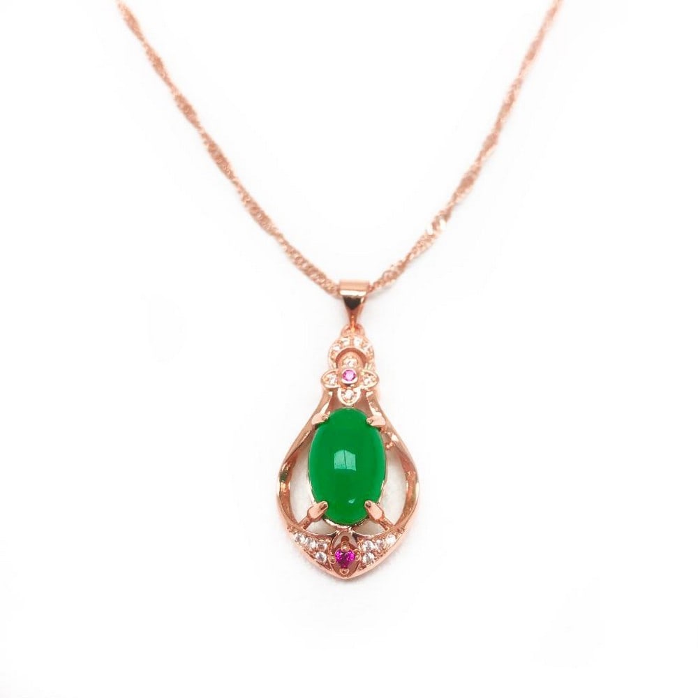 Carved Jade Pendant with Crystals in Rose Gold-Plated Sterling Silver: Carved Jade Pendant with Crystals in Rose Gold-Plated Sterling Silver A harmonious blend of natural beauty and sparkling elegance, this pendant features a finely carved jade stone framed by