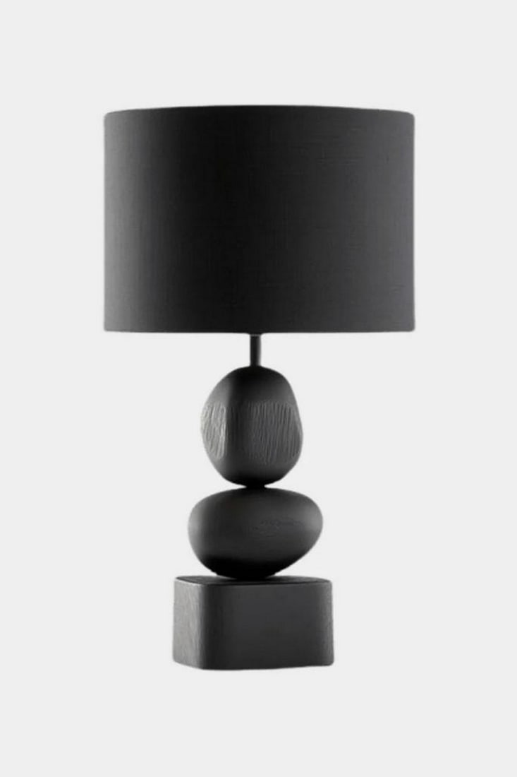 Contemporary Monochrome Wood Table Lamp: Contemporary Monochrome Wood Table Lamp This table lamp features a sculptural stacked base composed of rounded wooden forms finished in a uniform matte black. The textured surface highlights the