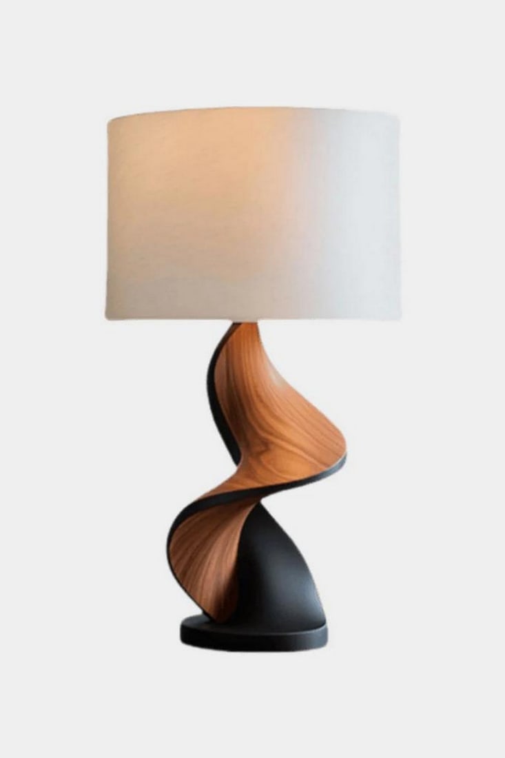 Spiral Twist Wooden Table Lamp: Spiral Twist Wooden Table Lamp Dynamic and refined, this handcrafted table lamp features a sculptural spiral base that blends rich wood tones with matte black accents. The twisting form evokes