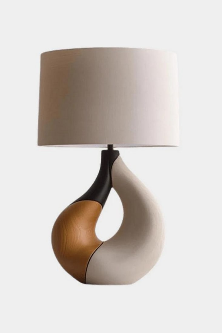 Tricolor Loop Wooden Table Lamp: Tricolor Loop Wooden Table Lamp Striking and sculptural, this handcrafted table lamp features a twisted loop base that seamlessly blends three finishes: natural wood grain, matte black, and smooth