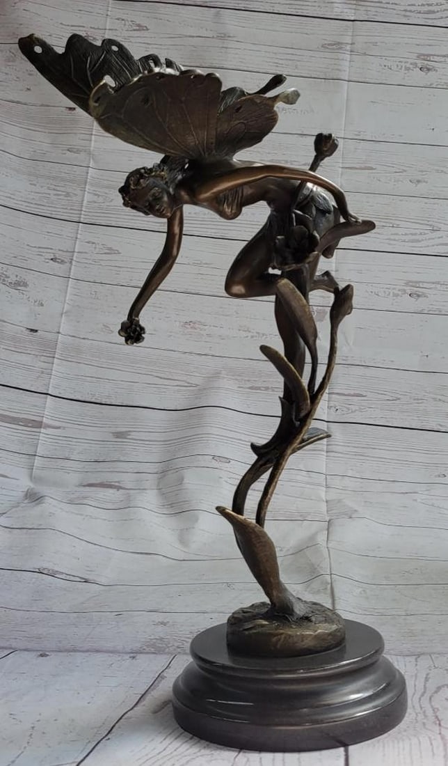 Original "Flying Floral Fairy" Sculpture On Marble Base - 10lbs: Behold the enchanting Fairy, descending from the celestial realms to protect and bring light to our world. Clad in a flowing robe and adorned with delicate sandals, she carries a profound message on h