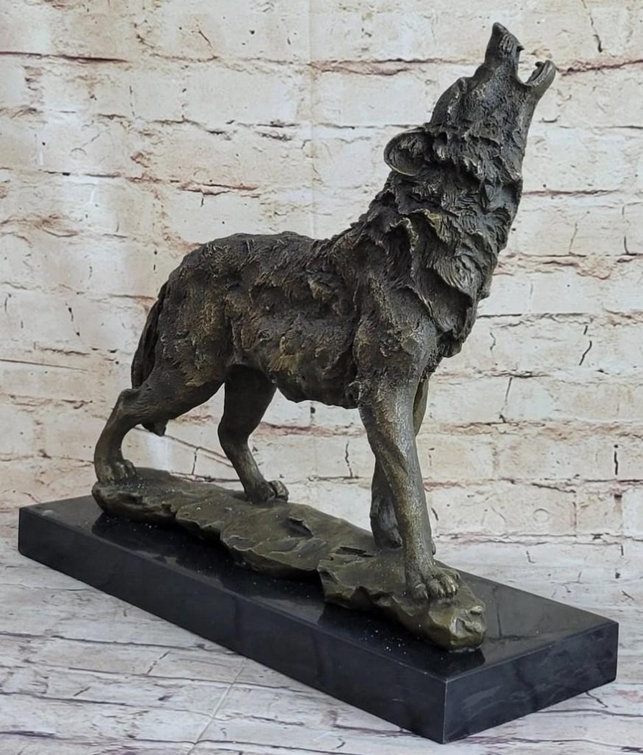 Howling Dire Wolf Bronze Sculpture: Howling Dire Wolf Bronze Sculpture A wolf howls into the air to express pain or to signal to other Wolf. This Wolf dog has thick fur growing wildly in all directions. Wolves are social predators that 