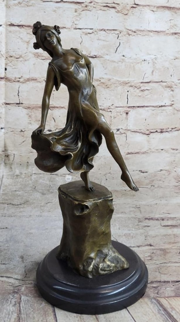 Handmade Detailed Collectible Dancer - Inspired by Vallet Bronze Sculpture - 14lbs: Graceful fairly like figurine, with aloof expression and art Nouveau hair style, and is a solid cast. Handmade of 100% bronze and resting on a solid black marble base this sculpture has a two tone bro