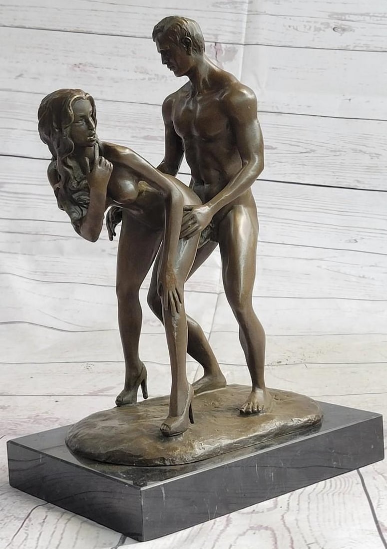 Intimate Connection Bronze Sculpture: Intimate Connection Bronze Sculpture This stunning bronze sculpture captures the raw, emotional energy between a woman and a man in a moment of profound connection. The woman, standing with her back t
