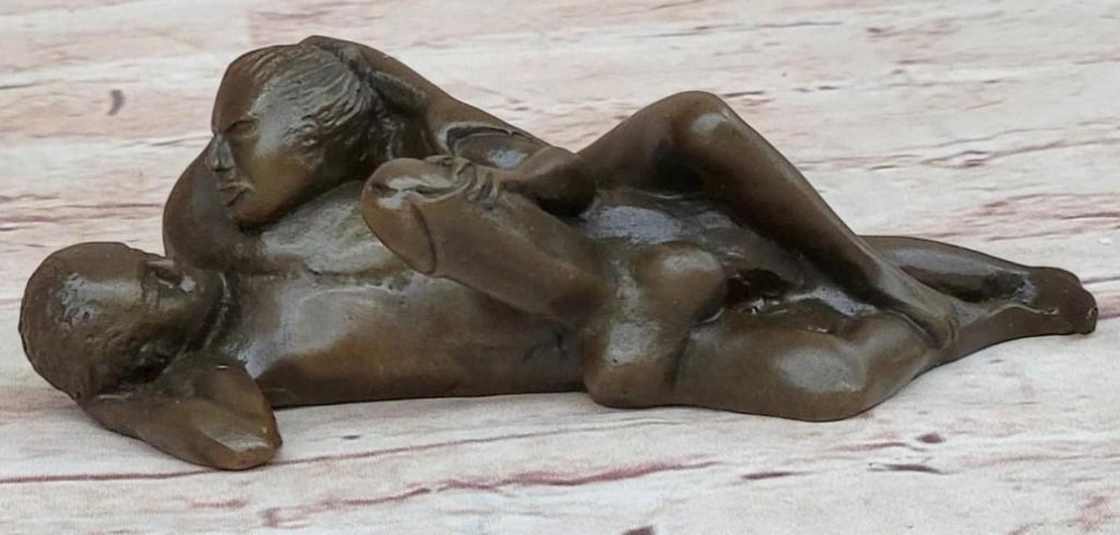 Abstract Nude Man and Woman Sculpture: Abstract Nude Man and Woman Sculpture This is an abstract bronze sculpture, bearing the signature of artist Milo, that captures the intimate connection between a man and a woman, their bodies morphing