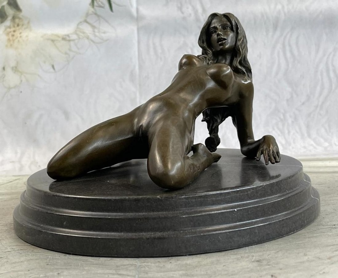 Nude Female Woman Bronze Sculpture - 5.5" x 8": Nude Female Woman Bronze Sculpture - 5.5" x 8" The nude seductress lies on the ground in the grasp of a feverish desire. The bronze sculpture, capturing woman sexuality, was cast using the ear