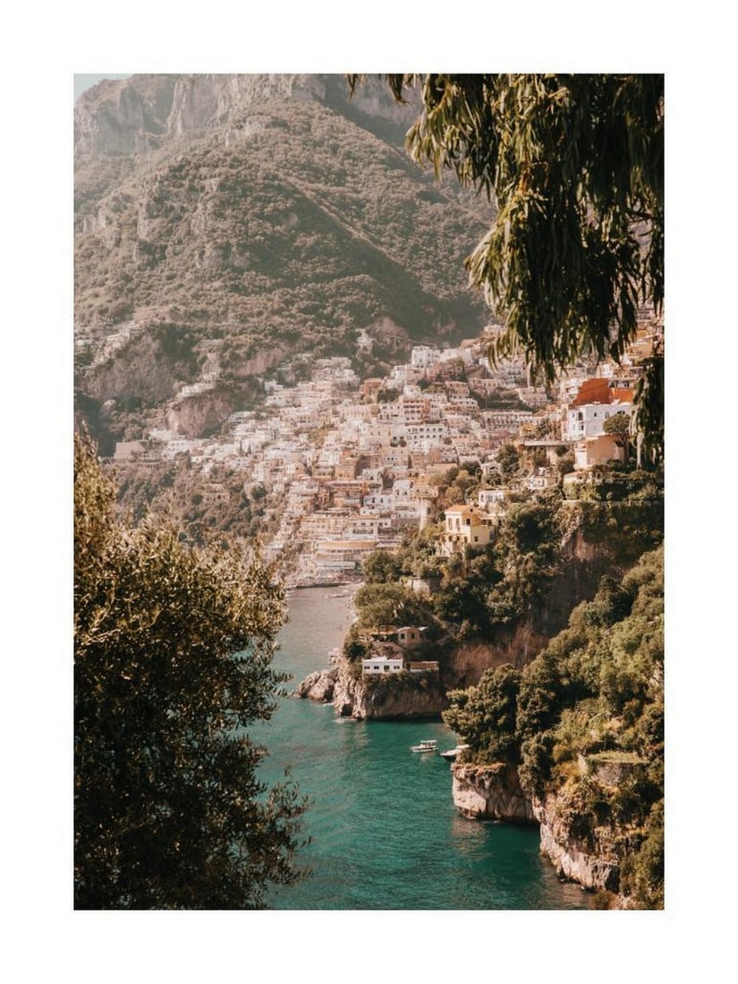 Positano Coastline Poster: Positano Coastline Poster A scenic print of Positano, featuring colorful hillside houses overlooking the turquoise waters of the Amalfi Coast. The vibrant tones and layered architecture capture the
