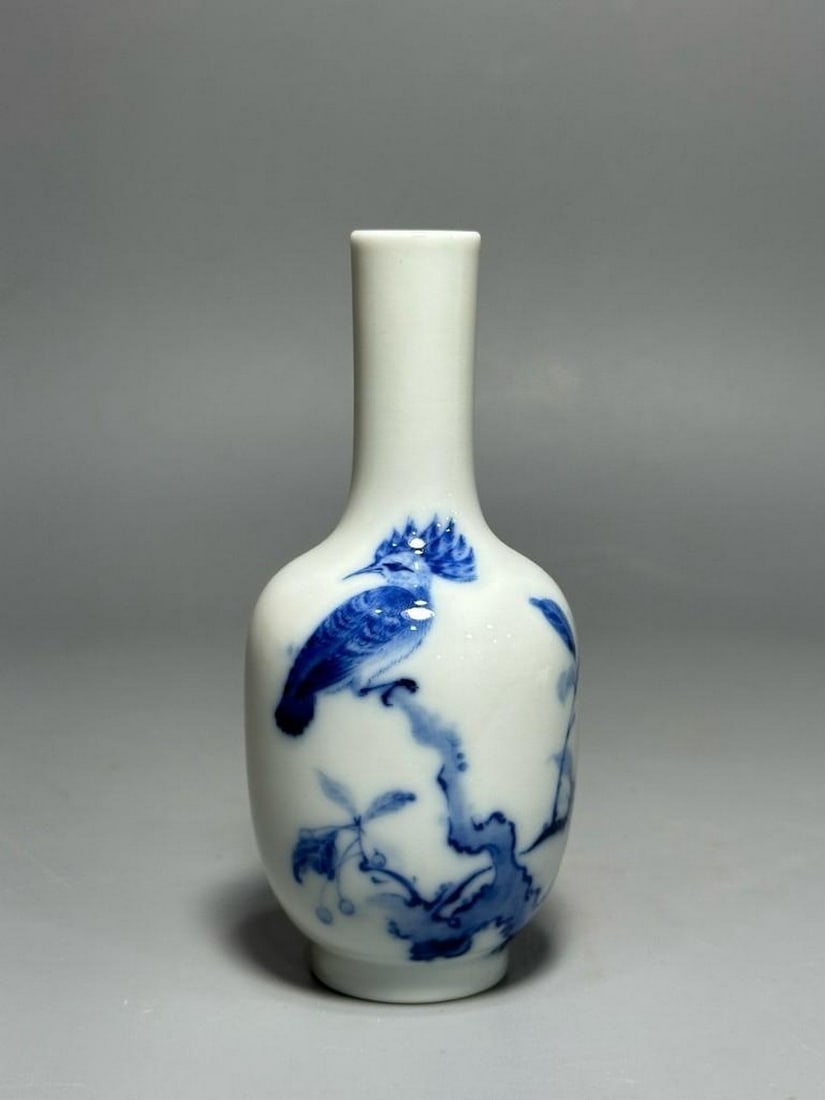 Wang Bu Mark Blue and White Flowers Guanyin Buddha Vase: Wang Bu Mark Blue and White Flowers Guanyin Buddha Vase A finely crafted porcelain vase bearing the Wang Bu mark, decorated in classic blue and white underglaze. The body features delicately painted