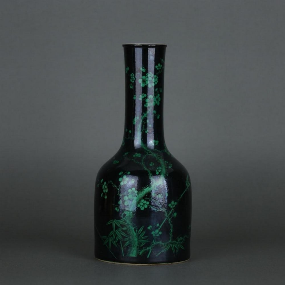 Qing Dynasty Black Ground Ink-Green Plum and Bamboo Pattern Vase: Qing Dynasty Black Ground Ink-Green Plum and Bamboo Pattern Vase A finely crafted porcelain vase from the Qing Dynasty, featuring a striking black ground decorated with delicate ink-green plum and bam