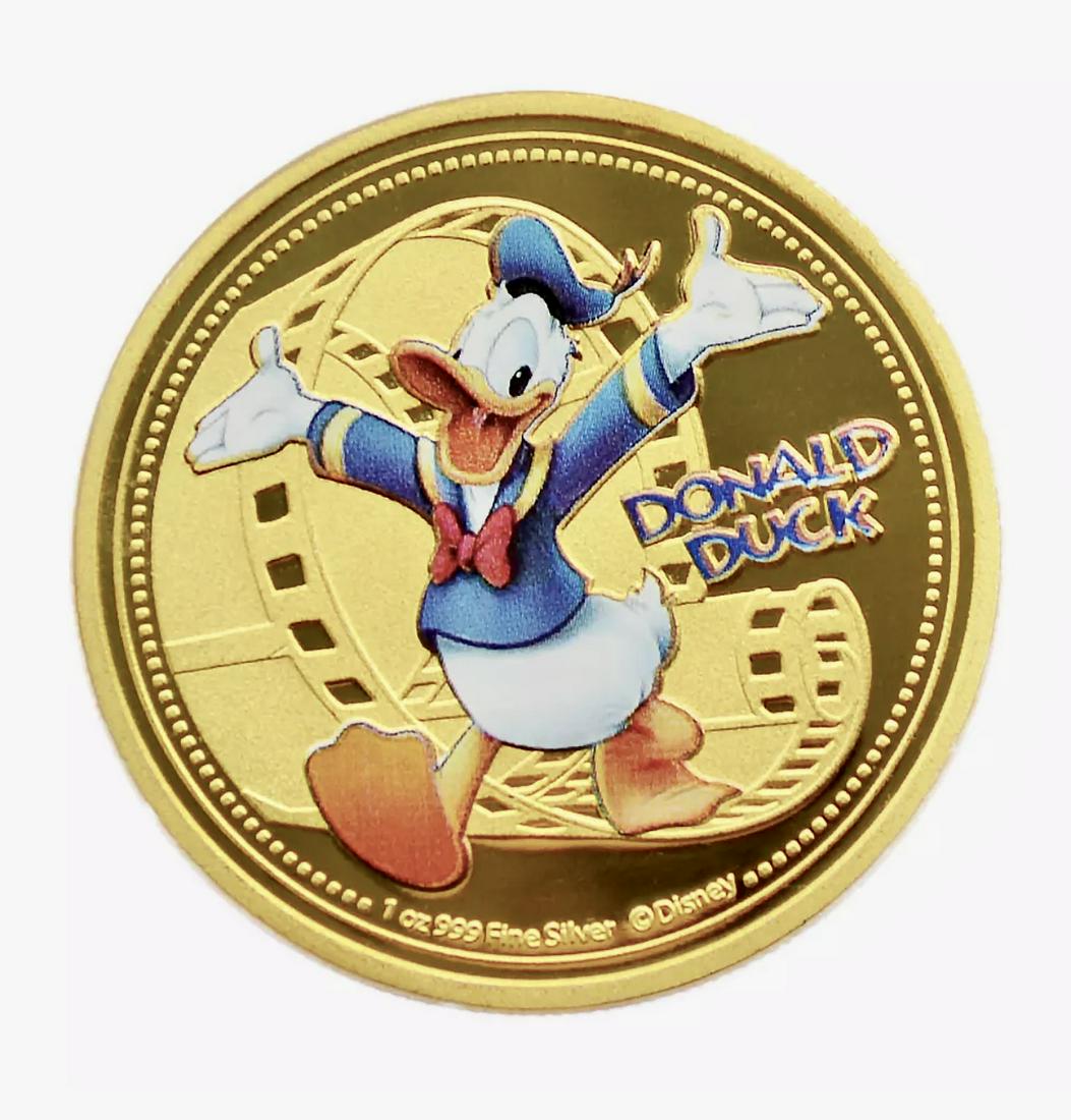 Disney DONALD DUCK 1oz .999 Fine Clad Silver/Gold Coin: Encapsulated / Gold & Silver Silver Clad/Plated â€“ Not Sterling Silver / Sold as a Collectible Novelty Item