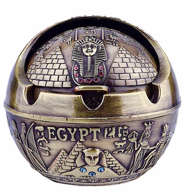 Egyptian Made Ornate King Tut Odorless Ashtray: Cylindrical Bronze Finished Piece that is Very Ornate â€“ It has Been on Display and Never Used â€“ The Door Opens and Closes to keep all odors inside â€“ It is an awesome looking shelf