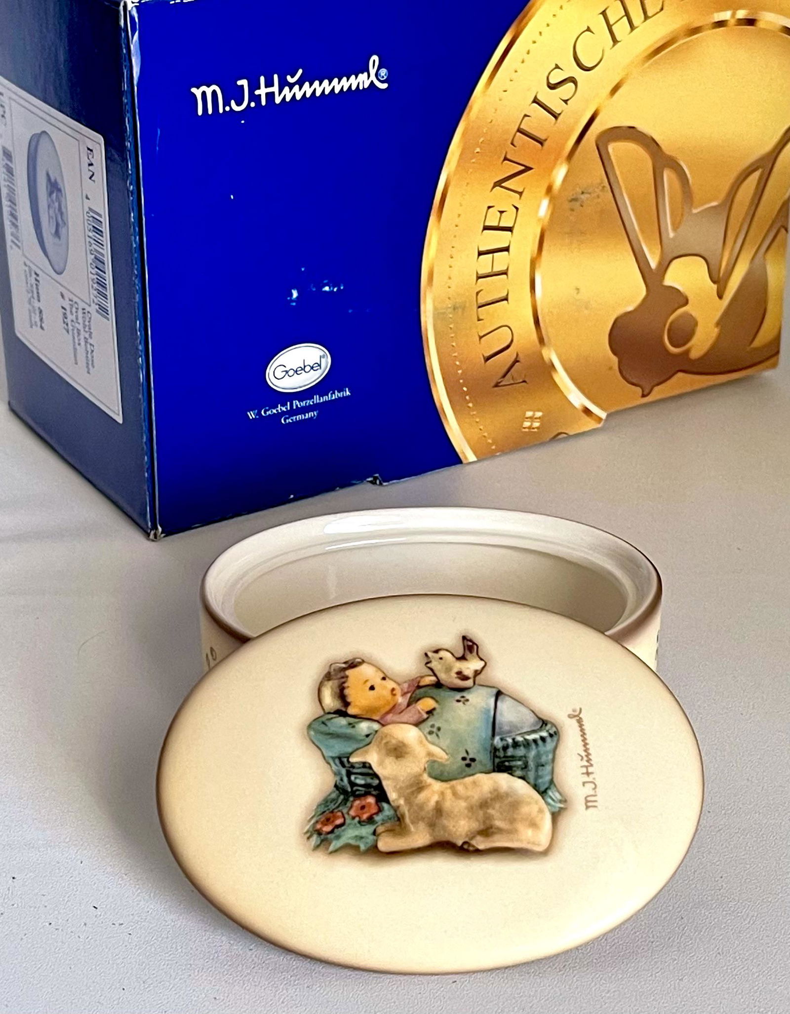 MJ Hummel Goebel Germany Porcelain Dresser Trinket Box: You are Bidding on a Retired Hummel Goebel Made in Germany Dresser Trinket Box that has never been out of its original box for use. It is in Mint Condition â€“ Multiple Photos Posted