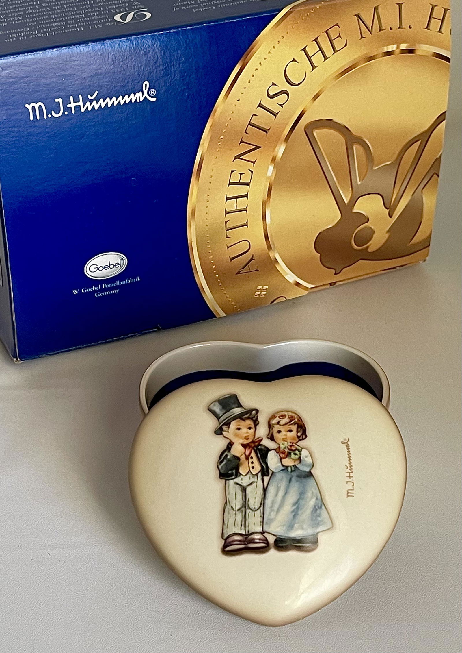 MJ Hummel Goebel Germany Porcelain Dresser Trinket Box: You are Bidding on a Retired Hummel Goebel Made in Germany Dresser Trinket Box that has never been out of its original box for use. It is in Mint Condition â€“ Multiple Photos Posted
