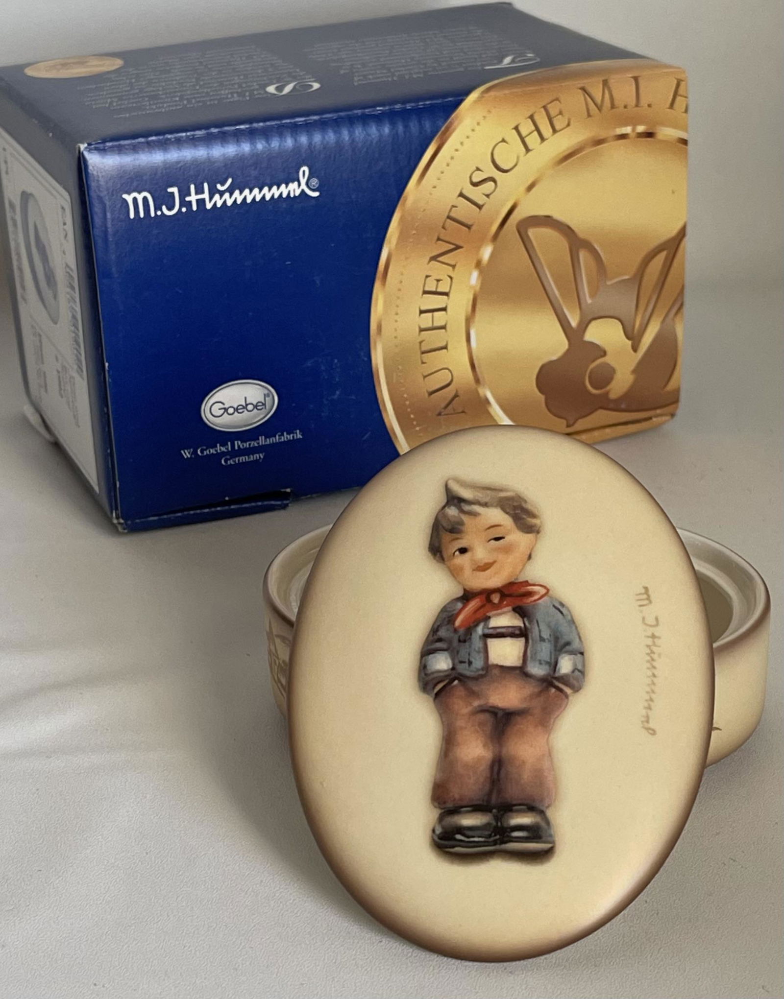 MJ Hummel Goebel Germany Porcelain Dresser Trinket Box: You are Bidding on a Retired Hummel Goebel Made in Germany Dresser Trinket Box that has never been out of its original box for use. It is in Mint Condition â€“ Multiple Photos Posted