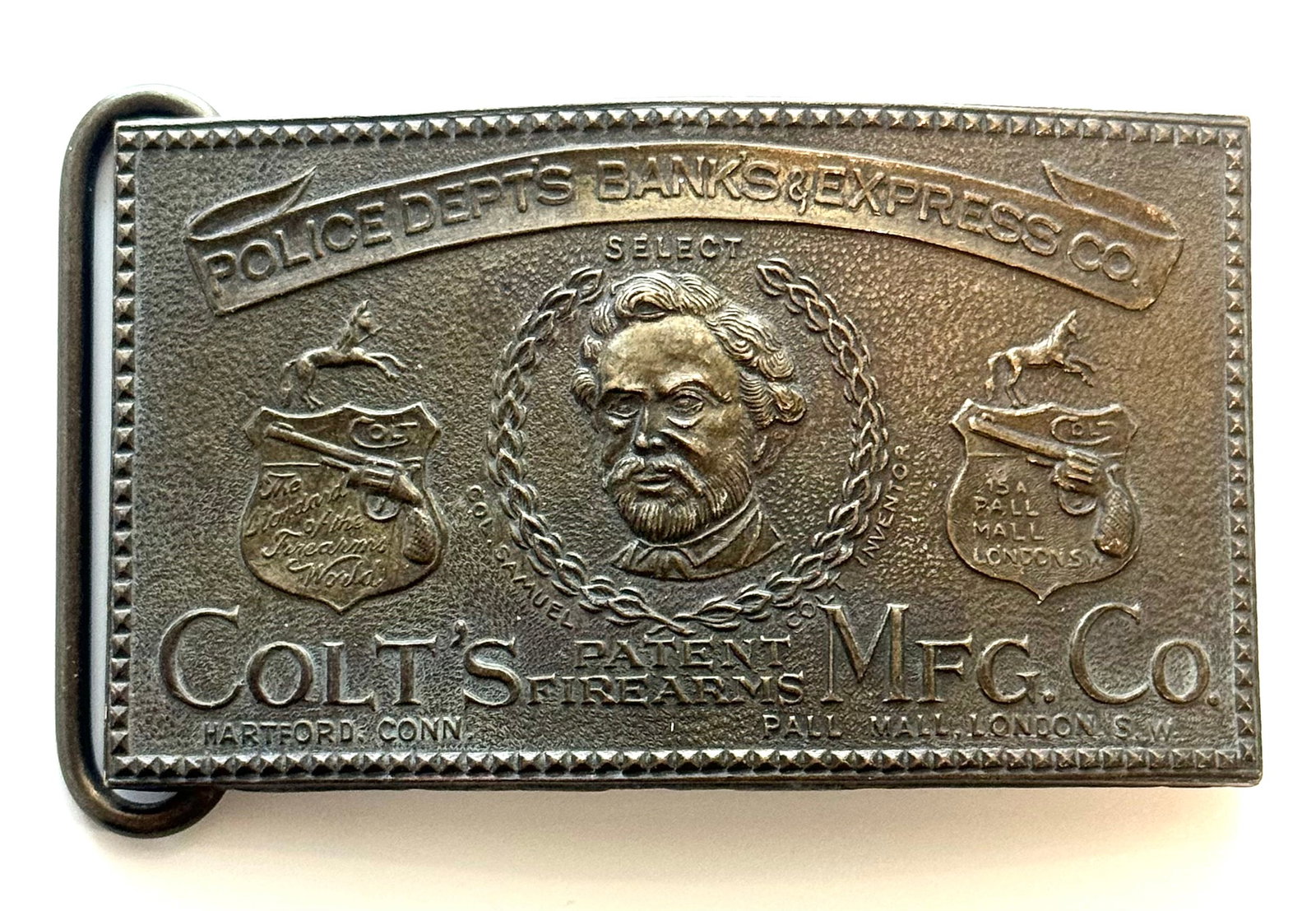 Signed Tiffany and Co Samuel Colt Gun Company Belt Buckle: Signed Tiffany and Co along with Tiffany Broadway NY. It also reads on the front Colts Patent Firearms Mfg. Co along with Police Depts Banks and Express CO. This Belt Buckle has Natural Patina. We are