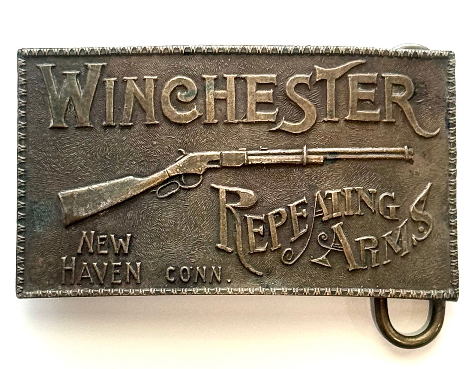 Signed Tiffany and Co Winchester Rifle Repeating Arms Belt Buckle: This also Reads on the backside A Gift from Buffalo Bill. This Belt Buckle has Natural Patina. We are Not Certain this is an Original therefore it is being Sold to the Highest Bidder AS-IS with No Ret