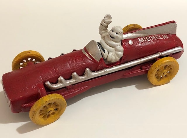 Vintage Cast Iron Michelin Man Driving Toy Car: Approximately 10-11 Inches Long – Great Piece