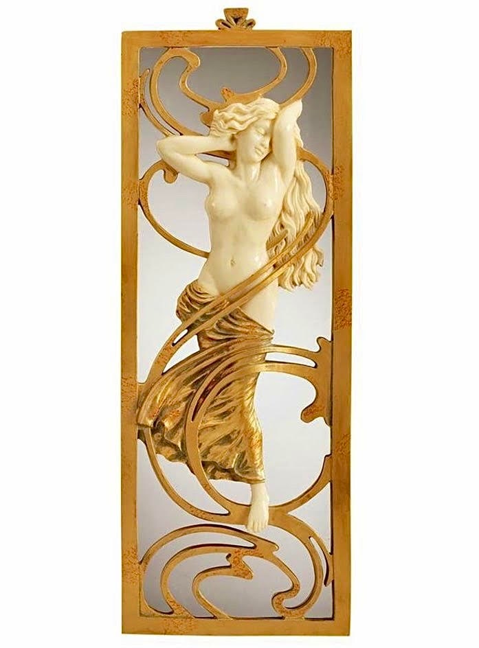Art Nouveau Style Parisian Salon Sculptured Wall Mirror: Approximately 19 Inches Tall. This Wall Mirror Features a Beautiful Nude Maiden cast in designer resin and finished in faux ivory and gold leaf and is Highly Detailed. It has never been on Display. Th