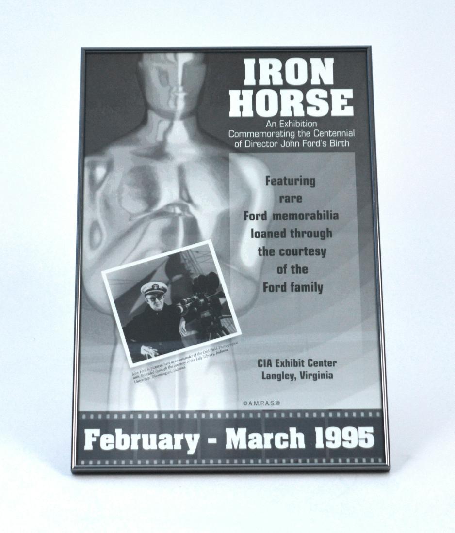 CIA Poster Commemorating War Filmmaker John Ford: Extremely rare CIA poster for an exhibit dedicated to the director and six-time Oscar winner John Ford. The exhibition commemorated the Centennial of John Ford’s birth. Emmy committee in Hollywood m