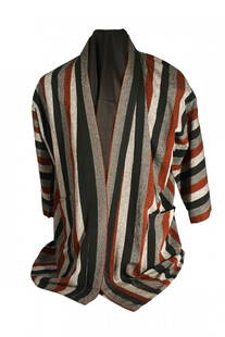 Thelonious Monk's Original Shirt: Original shirt belonging to Jazz legend Thelonious Monk. No tag on the shirt, flowing woven material with pockets and vertical stripes. Due to heavy use by Monk, minor restitching is required. From th