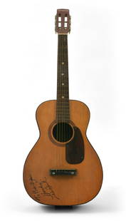 Les Paul Acoustic guitar inscribed to Bob Dylan: Les Paul loved Bob Dylan. When he was in his 20s he would play an acoustic guitar with a harmonica holder he had crafted himself out of a coat hanger and some wood, he also felt a kinship between