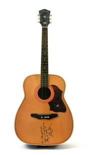 Les Paul inscribed guitar to (The Artist) Prince: This acoustic guitar has one of the rarest Les Paul signatures in the world. It is a vital part of music history as it demonstrates the influence one artist can have on another. Les Paul, upon