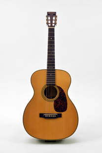 Martin Guitar Norman Blake Signature Edition Acoustic: A limited edition Martin guitar; Norman Blake Signature Edition, #31/100. Serial #4002589. Sides and back are Brazilian rosewood. Mint condition.Ornamental mother of pearl inlays on fret board. 